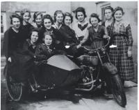 Women around motorcycle
